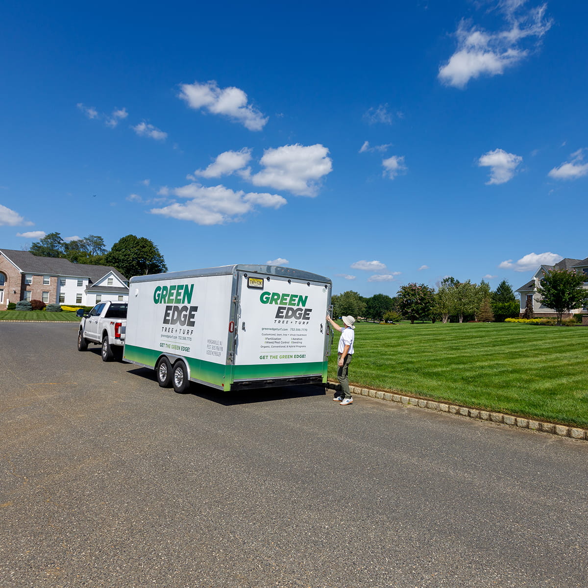 Lush green lawn with Green Edge's Fair Haven custom fertilization, weed control, and seeding programs.