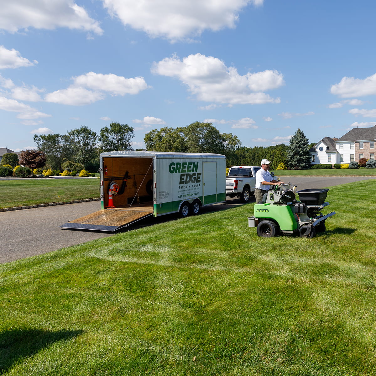 Lush green lawn with Green Edge's Manalapan custom fertilization, weed control, and seeding programs.