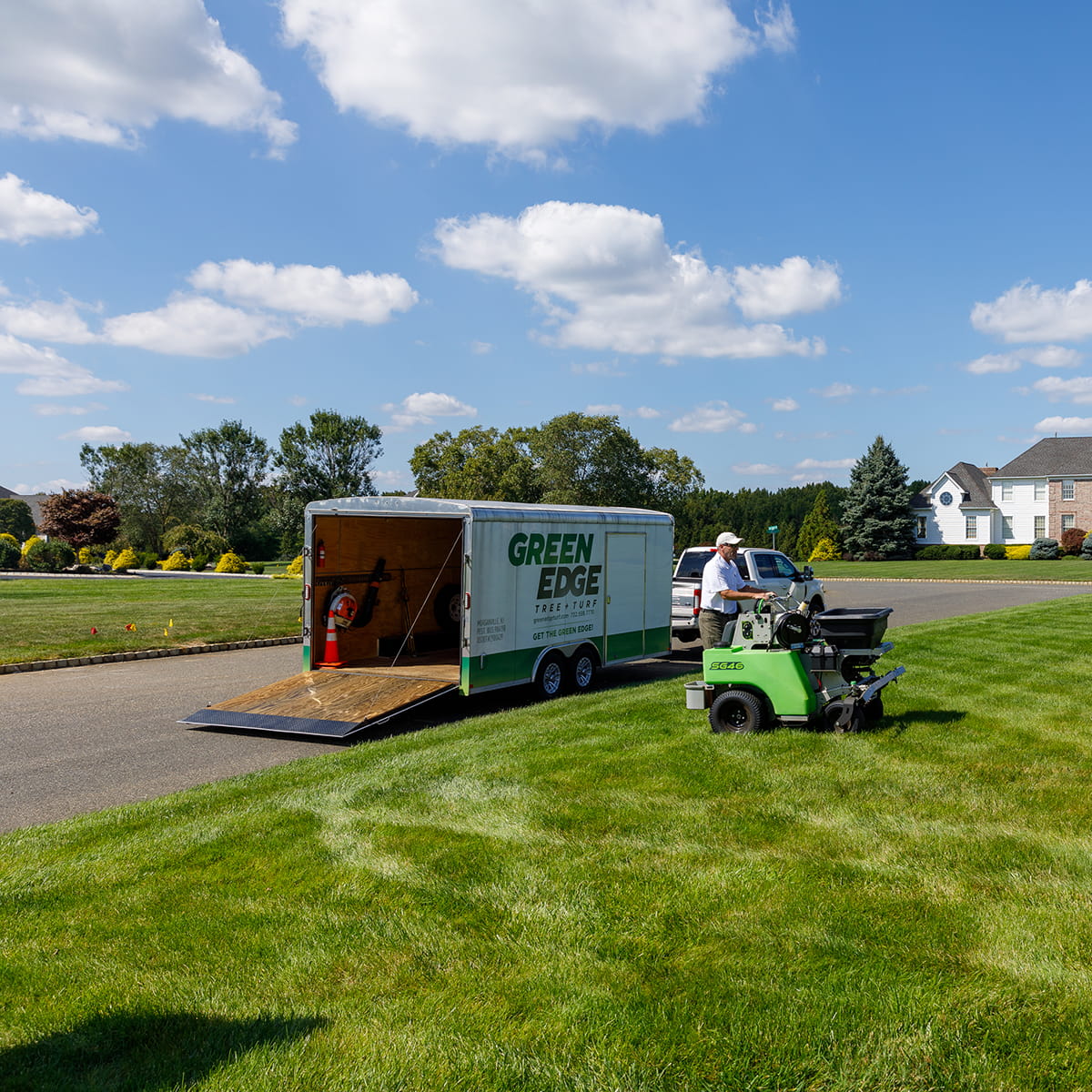 Lush green lawn with Green Edge's Marlboro custom fertilization, weed control, and seeding programs.